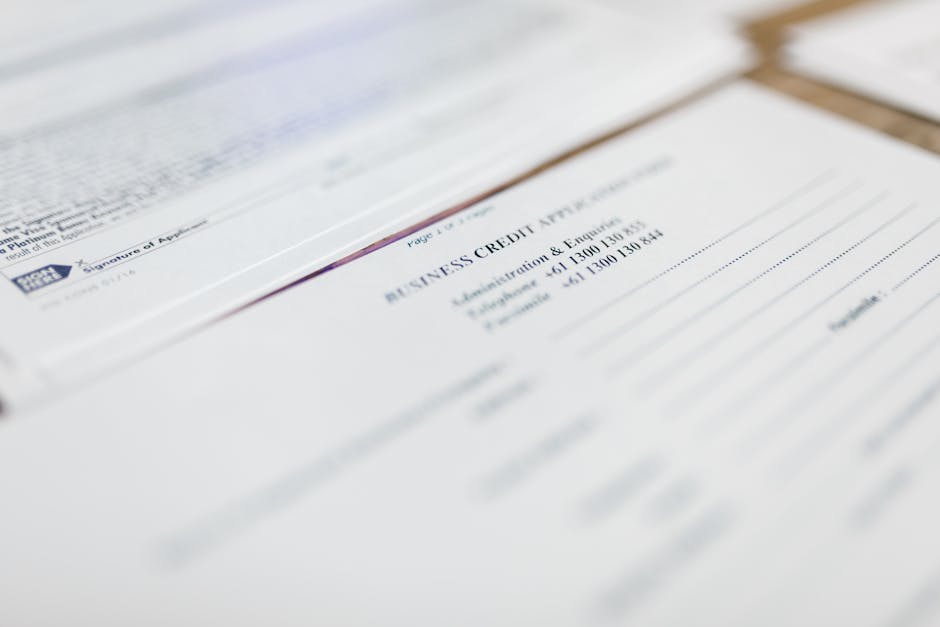 Focused image of business credit application papers, ideal for finance themes.